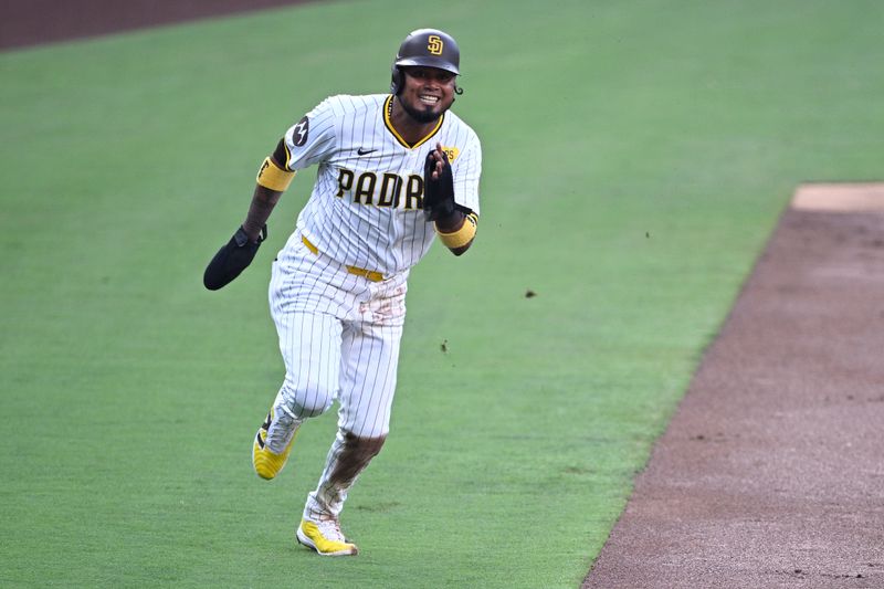 Jul 6, 2024; San Diego, California, USA; San Diego Padres second baseman Luis Arraez (4) advances home to score a run on a single hit by third baseman Manny Machado (not pictured) during the first inning against the Arizona Diamondbacks at Petco Park. Mandatory Credit: Orlando Ramirez-USA TODAY Sports