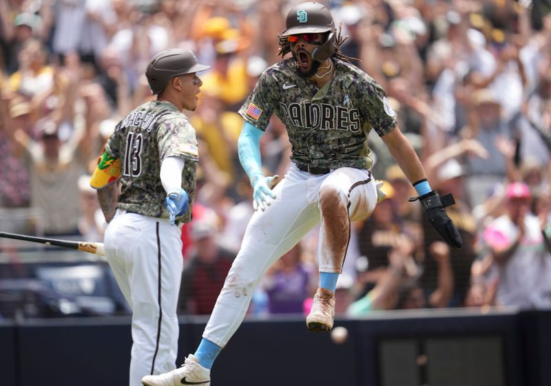 Jun 18, 2023; San Diego, California, USA;  San Diego Padres right fielder Fernando Tatis Jr. (23) reacts after scoring on a fielders choice by left fielder Juan Soto (not pictured) against the Tampa Bay Rays during the third inning at Petco Park. Mandatory Credit: Ray Acevedo-USA TODAY Sports