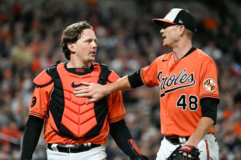 Sep 30, 2023; Baltimore, Maryland, USA;  Baltimore Orioles starting pitcher Kyle Gibson (48) speaks with  catcher Adley Rutschman (35) after the third inning against the Boston Red Sox at Oriole Park at Camden Yards. Mandatory Credit: Tommy Gilligan-USA TODAY Sports