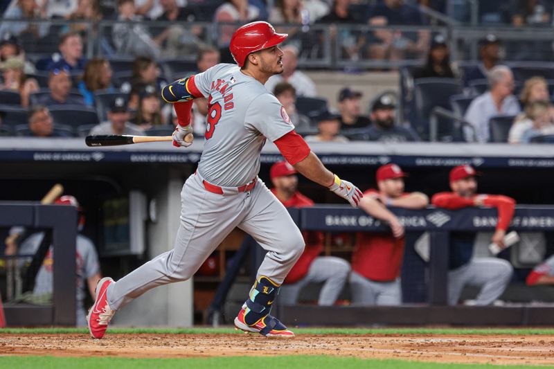 Aug 30, 2024; Bronx, New York, USA; St. Louis Cardinals third baseman Nolan Arenado (28) singles during the third inning against the New York Yankees at Yankee Stadium. Mandatory Credit: Vincent Carchietta-USA TODAY Sports