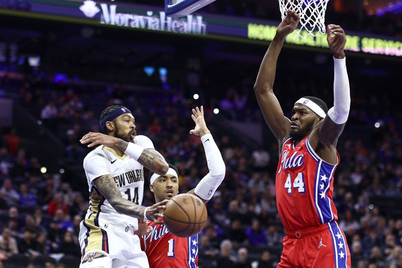 PHILADELPHIA, PENNSYLVANIA - MARCH 08: Brandon Ingram #14 of the New Orleans Pelicans passes the ball past KJ Martin #1 and Paul Reed #44 of the Philadelphia 76ers during the first quarter at the Wells Fargo Center on March 08, 2024 in Philadelphia, Pennsylvania. NOTE TO USER: User expressly acknowledges and agrees that, by downloading and or using this photograph, User is consenting to the terms and conditions of the Getty Images License Agreement.  (Photo by Tim Nwachukwu/Getty Images)