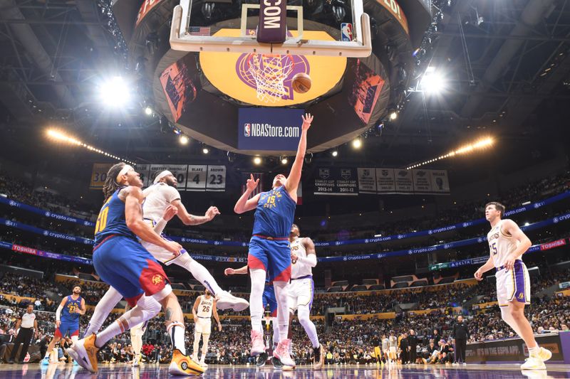 LOS ANGELES, CA - MARCH 2: Nikola Jokic #15 of the Denver Nuggets drives to the basket during the game against the Los Angeles Lakers on March 2, 2024 at Crypto.Com Arena in Los Angeles, California. NOTE TO USER: User expressly acknowledges and agrees that, by downloading and/or using this Photograph, user is consenting to the terms and conditions of the Getty Images License Agreement. Mandatory Copyright Notice: Copyright 2024 NBAE (Photo by Andrew D. Bernstein/NBAE via Getty Images)