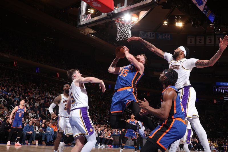 NEW YORK, NY - FEBRUARY 3: Isaiah Hartenstein #55 of the New York Knicks drives to the basket during the game against the Los Angeles Lakers on February 3, 2024 at Madison Square Garden in New York City, New York.  NOTE TO USER: User expressly acknowledges and agrees that, by downloading and or using this photograph, User is consenting to the terms and conditions of the Getty Images License Agreement. Mandatory Copyright Notice: Copyright 2024 NBAE  (Photo by Nathaniel S. Butler/NBAE via Getty Images)