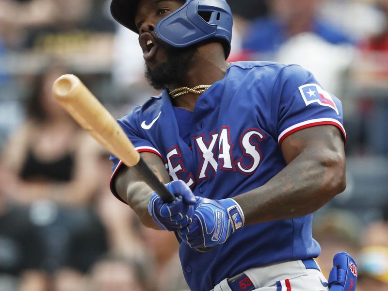 May 23, 2023; Pittsburgh, Pennsylvania, USA; Texas Rangers right fielder Adolis Garcia (53) hits a double against the Pittsburgh Pirates during the third inning at PNC Park. Mandatory Credit: Charles LeClaire-USA TODAY Sports