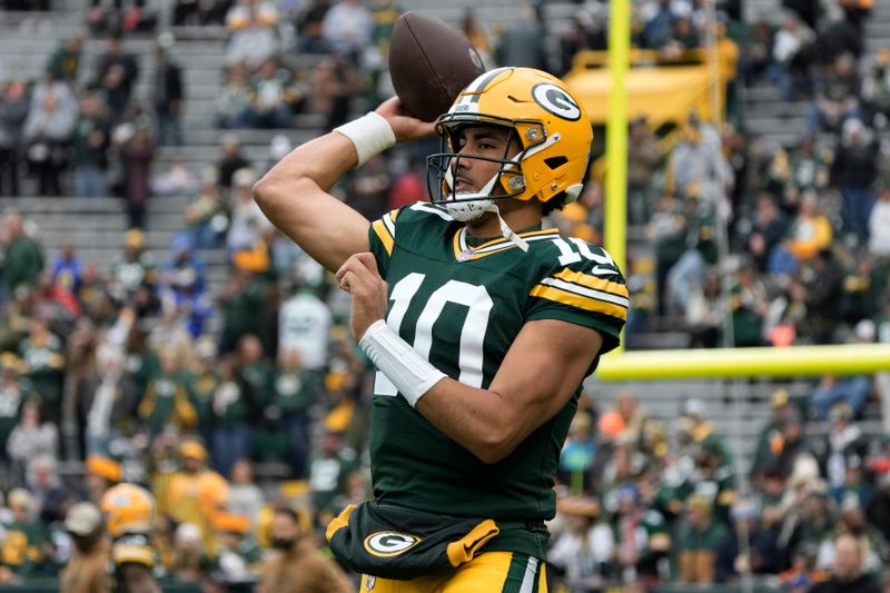 Green Bay Packers quarterback Jordan Love warms up before an NFL football game against the Los Angeles Rams, Sunday, Nov. 5, 2023, in Green Bay, Wis. (AP Photo/Morry Gash)