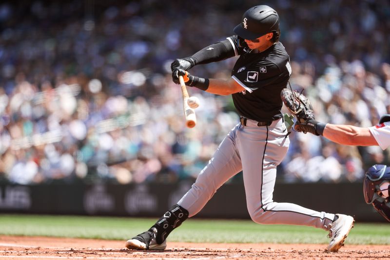 Aug 7, 2025; Seattle, Washington, USA; Chicago White Sox left fielder Brooks Baldwin (27) hits a foul ball during the second inning against the Seattle Mariners at T-Mobile Park. Mandatory Credit: Kevin Ng-Imagn Images
