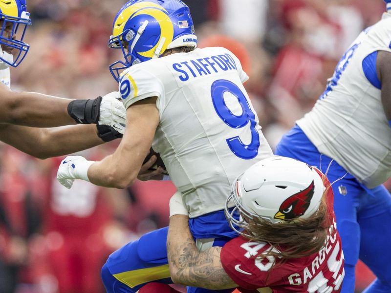 Los Angeles Rams quarterback Matthew Stafford (9) is sacked by Arizona Cardinals linebacker Dennis Gardeck (45) in an NFL football game, Sunday, Sept. 15, 2024, in Glendale, Ariz. (AP Photo/Jeff Lewis)