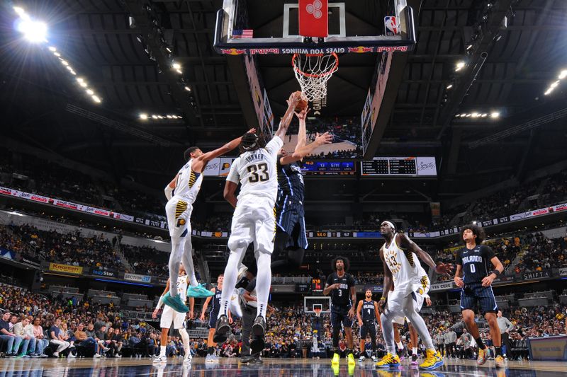 INDIANAPOLIS, IN - NOVEMBER 6: Myles Turner #33 of the Indiana Pacers block during the game against the Orlando Magic on November 6, 2024 at Gainbridge Fieldhouse in Indianapolis, Indiana. NOTE TO USER: User expressly acknowledges and agrees that, by downloading and or using this Photograph, user is consenting to the terms and conditions of the Getty Images License Agreement. Mandatory Copyright Notice: Copyright 2024 NBAE (Photo by Ron Hoskins/NBAE via Getty Images)