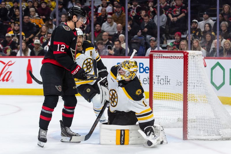 Jan 18, 2025; Ottawa, Ontario, CAN; Boston Bruins goalie Jeremy Swayman (1) makes a save on a shot from Ottawa Senators center Shane Pinto (12) in the first period at the Canadian Tire Centre. Mandatory Credit: Marc DesRosiers-Imagn Images