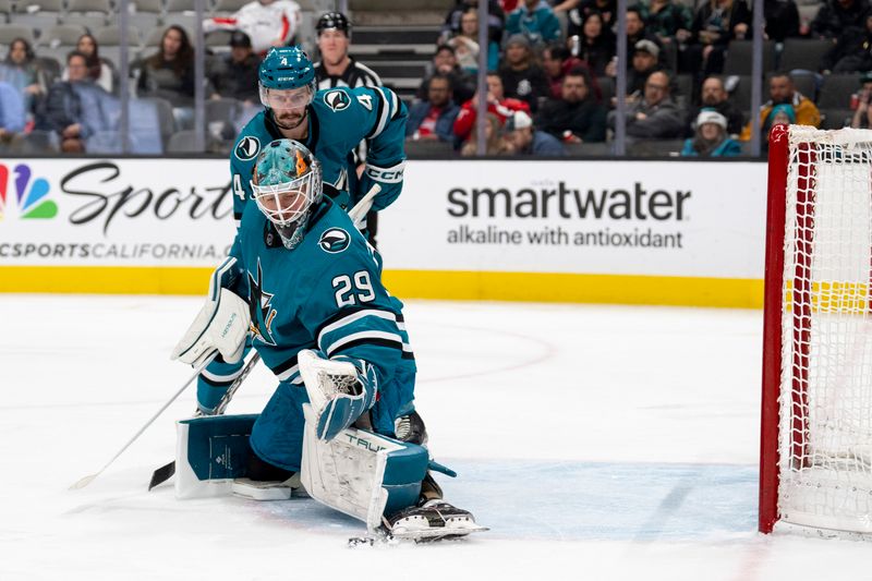 Nov 27, 2023; San Jose, California, USA; San Jose Sharks goaltender Mackenzie Blackwood (29) makes a glove save during the first period against the Washington Capitals at SAP Center at San Jose. Mandatory Credit: Neville E. Guard-USA TODAY Sports