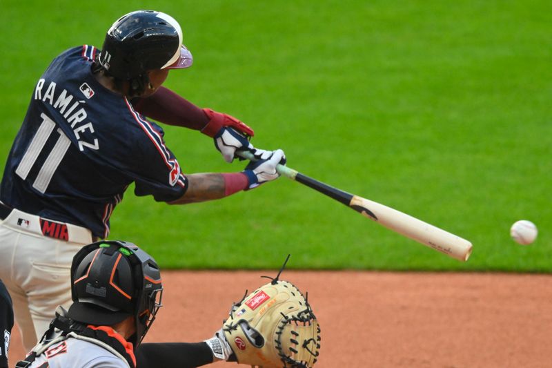 Jul 5, 2024; Cleveland, Ohio, USA; Cleveland Guardians third baseman Jose Ramirez (11) singles in the first inning against the San Francisco Giants at Progressive Field. Mandatory Credit: David Richard-USA TODAY Sports