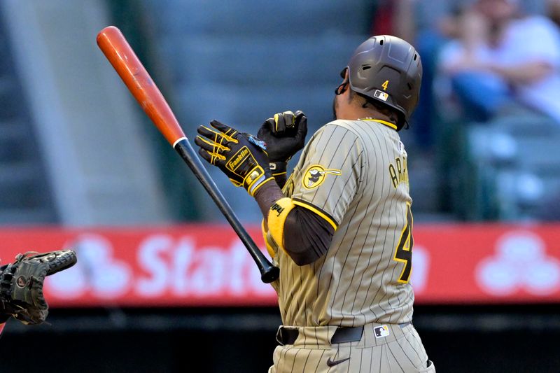 Jun 4, 2024; Anaheim, California, USA;  San Diego Padres second baseman Luis Arraez (4) drops his bat after he was hit by a pitch in the third inning against the Los Angeles Angels at Angel Stadium. Mandatory Credit: Jayne Kamin-Oncea-USA TODAY Sports