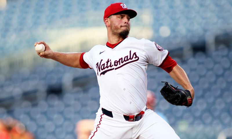 Jul 6, 2024; Washington, District of Columbia, USA; Washington Nationals pitcher Tanner Rainey (21) throws a pitch during the ninth inning against the St. Louis Cardinals at Nationals Park. Mandatory Credit: Daniel Kucin Jr.-USA TODAY Sports