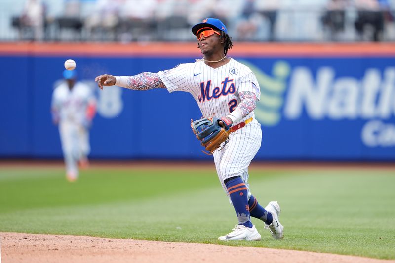 Jun 1, 2025; New York City, New York, USA; New York Mets second baseman Luisangel Acuna (2) throws out Colorado Rockies shortstop Ezequiel Tovar (14) (not pictured) after fielding a ground ball during the sixth inning at Citi Field. Mandatory Credit: Gregory Fisher-Imagn Images