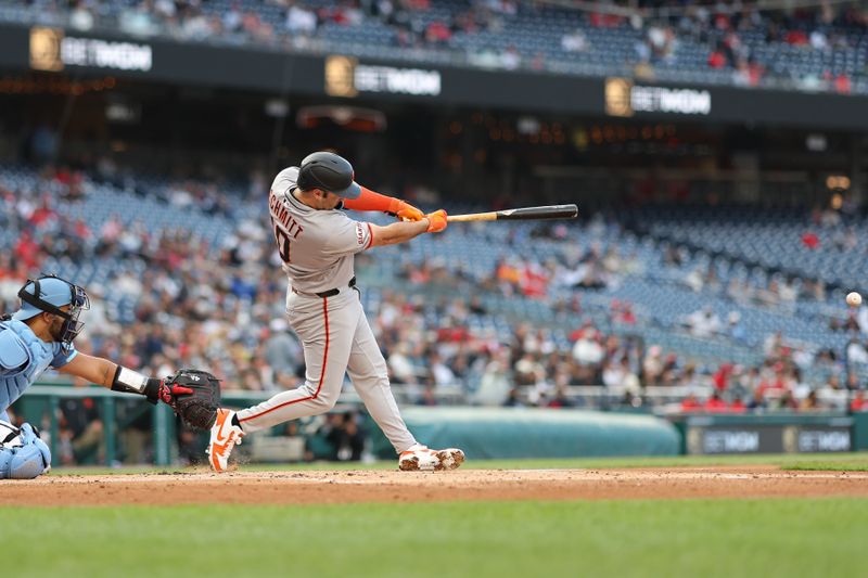 May 23, 2025; Washington, District of Columbia, USA; San Francisco Giants first base Casey Schmitt (10) singles against the Washington Nationals during the second inning at Nationals Park. Mandatory Credit: Geoff Burke-Imagn Images