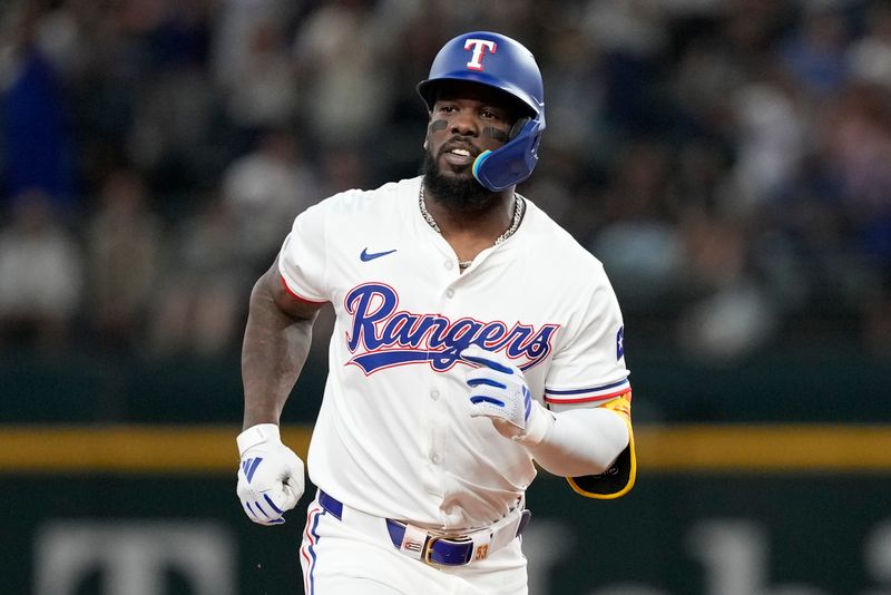 Apr 24, 2024; Arlington, Texas, USA; Texas Rangers right fielder Adolis García (53) circles the bases after hitting a home run against the Seattle Mariners during the fourth inning at Globe Life Field. Mandatory Credit: Jim Cowsert-USA TODAY Sports