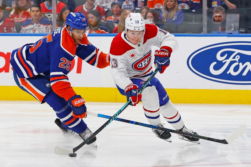 Oct 23, 2025; Edmonton, Alberta, CAN; Montreal Canadiens forward Cole Caufield (13) carries the puck around Edmonton Oilers defensemen Darnell Nurse (25) during the second period at Rogers Place. Mandatory Credit: Perry Nelson-Imagn Images