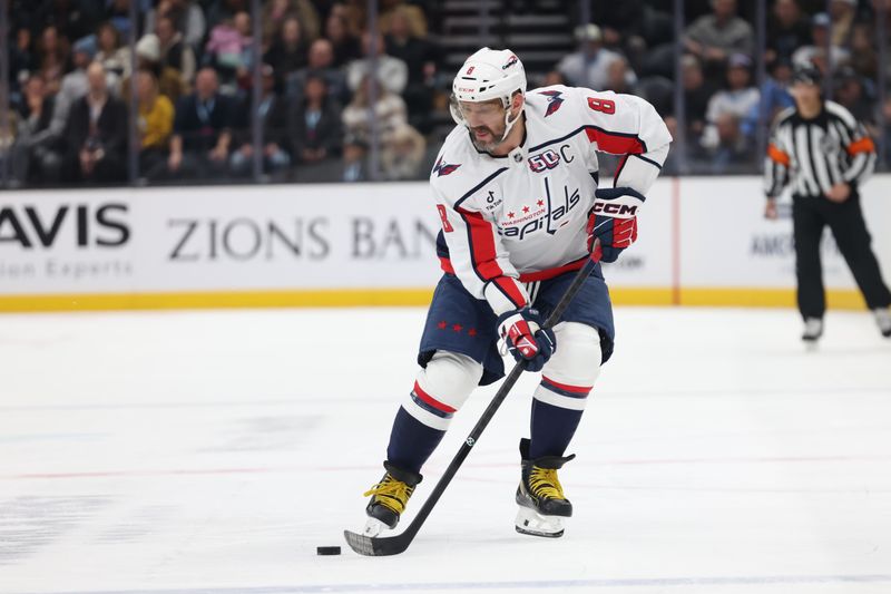 Nov 18, 2024; Salt Lake City, Utah, USA; Washington Capitals left wing Alex Ovechkin (8) skates with the puck against against the Utah Hockey Club during the first period at Delta Center. Mandatory Credit: Rob Gray-Imagn Images