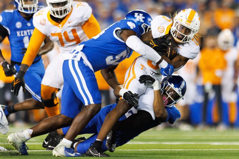 Oct 28, 2023; Lexington, Kentucky, USA; Tennessee Volunteers running back Jaylen Wright (0) is tackled by Kentucky Wildcats linebacker D'Eryk Jackson (54) during the first quarter at Kroger Field. Mandatory Credit: Jordan Prather-USA TODAY Sports