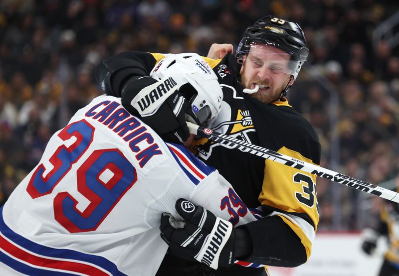 Jan 31, 2026; Pittsburgh, Pennsylvania, USA;  New York Rangers center Sam Carrick (39) and Pittsburgh Penguins right wing Anthony Mantha (right) tussle during the second period at PPG Paints Arena. Mandatory Credit: Charles LeClaire-Imagn Images