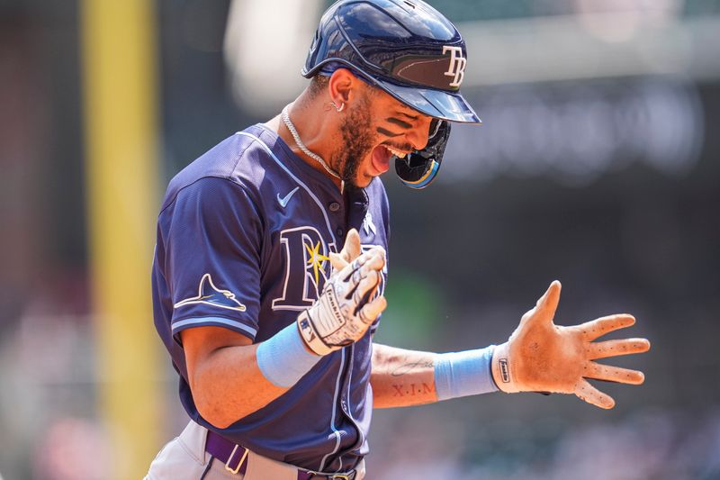 Jun 16, 2024; Cumberland, Georgia, USA; Tampa Bay Rays center fielder Jose Siri (22) reacts after hitting a two run go ahead home run against the Atlanta Braves during the ninth inning at Truist Park. Mandatory Credit: Dale Zanine-USA TODAY Sports