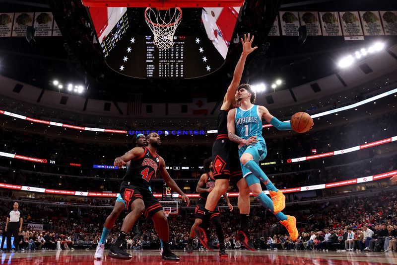 CHICAGO, ILLINOIS - JANUARY 17: LaMelo Ball #1 of the Charlotte Hornets looks to pass against the Chicago Bulls during the first quarter at the United Center on January 17, 2025 in Chicago, Illinois. NOTE TO USER: User expressly acknowledges and agrees that, by downloading and or using this photograph, user is consenting to the terms and conditions of the Getty Images License Agreement.  (Photo by Luke Hales/Getty Images)