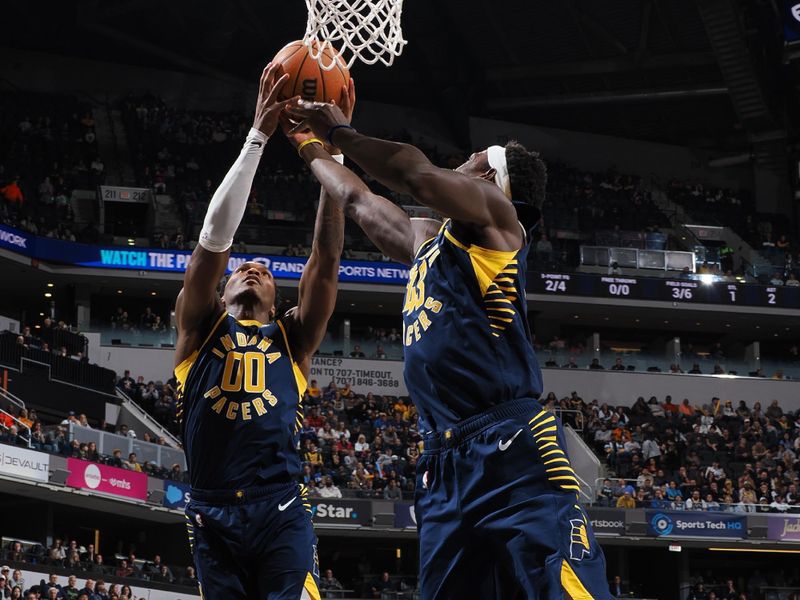 INDIANAPOLIS, IN - NOVEMBER 25: Bennedict Mathurin #00 of the Indiana Pacers rebounds the ball during the game against the New Orleans Pelicans on November 25, 2024 at Gainbridge Fieldhouse in Indianapolis, Indiana. NOTE TO USER: User expressly acknowledges and agrees that, by downloading and or using this Photograph, user is consenting to the terms and conditions of the Getty Images License Agreement. Mandatory Copyright Notice: Copyright 2024 NBAE (Photo by Ron Hoskins/NBAE via Getty Images)