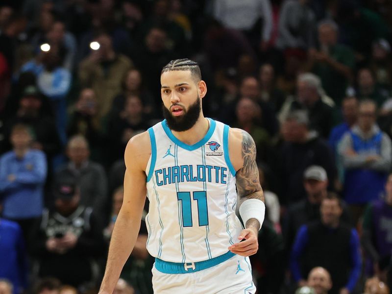 MILWAUKEE, WISCONSIN - FEBRUARY 09: Cody Martin #11 of the Charlotte Hornets handles the ball during a game against the Milwaukee Bucks at Fiserv Forum on February 09, 2024 in Milwaukee, Wisconsin. NOTE TO USER: User expressly acknowledges and agrees that, by downloading and or using this photograph, User is consenting to the terms and conditions of the Getty Images License Agreement. (Photo by Stacy Revere/Getty Images)