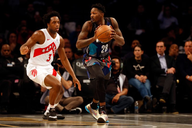 NEW YORK, NEW YORK - NOVEMBER 28: Dorian Finney-Smith #28 of the Brooklyn Nets dribbles as O.G. Anunoby #3 of the Toronto Raptors defends during the first half of an NBA In-Season Tournament game at Barclays Center on November 28, 2023 in the Brooklyn borough of New York City. NOTE TO USER: User expressly acknowledges and agrees that, by downloading and/or using this photograph, User is consenting to the terms and conditions of the Getty Images License Agreement. (Photo by Sarah Stier/Getty Images)