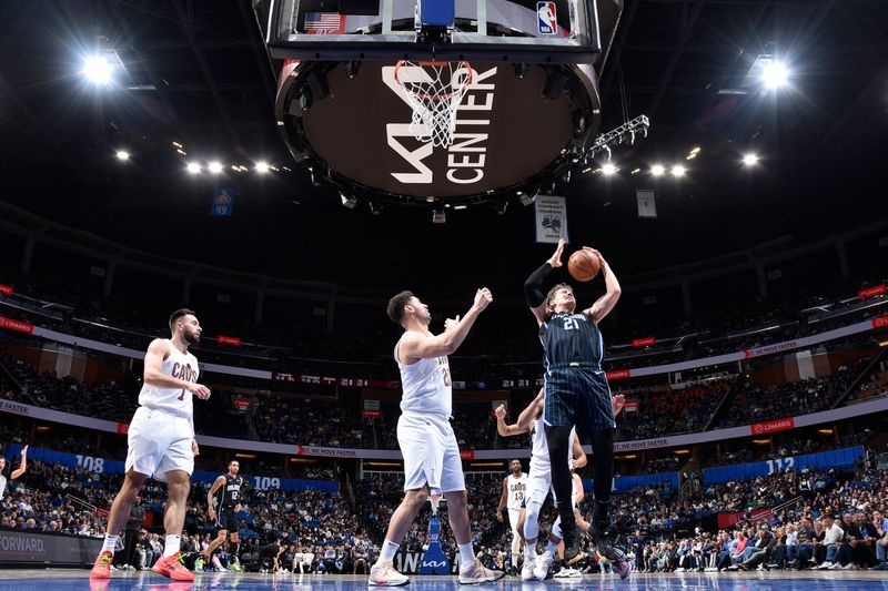 ORLANDO, FL - JANUARY 22: Moritz Wagner #21 of the Orlando Magic grabs a rebound during the game against the Cleveland Cavaliers on January 22, 2024 at Kia Center in Orlando, Florida. NOTE TO USER: User expressly acknowledges and agrees that, by downloading and or using this photograph, User is consenting to the terms and conditions of the Getty Images License Agreement. Mandatory Copyright Notice: Copyright 2024 NBAE (Photo by Fernando Medina/NBAE via Getty Images)