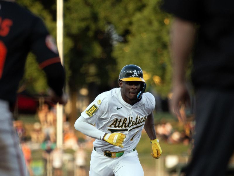 Jun 6, 2025; West Sacramento, California, USA; Athletics center fielder Denzel Clarke (1) heads for third base on Lawrence Butler’s double against the Baltimore Orioles during the third inning at Sutter Health Park. Mandatory Credit: D. Ross Cameron-Imagn Images