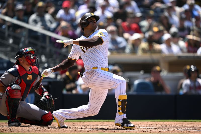 Apr 19, 2023; San Diego, California, USA; San Diego Padres left fielder Juan Soto (22) hits a home run against the Atlanta Braves during the fourth inning at Petco Park. Mandatory Credit: Orlando Ramirez-USA TODAY Sports