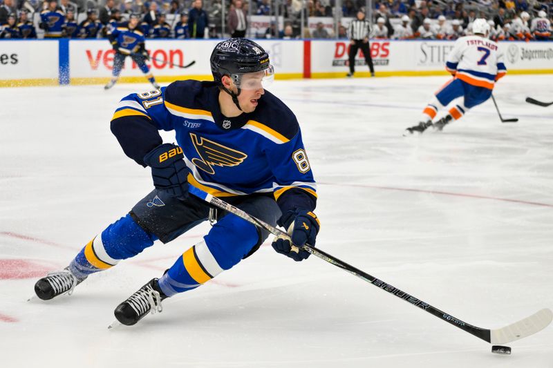 Oct 17, 2024; St. Louis, Missouri, USA;  St. Louis Blues center Dylan Holloway (81) controls the puck against the New York Islanders during the first period at Enterprise Center. Mandatory Credit: Jeff Curry-Imagn Images