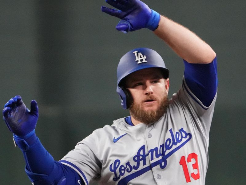 Aug 31, 2024; Phoenix, Arizona, USA; Los Angeles Dodgers third base Max Muncy (13) celebrates an RBI single against the Arizona Diamondbacks during the fifth inning at Chase Field. Mandatory Credit: Joe Camporeale-USA TODAY Sports