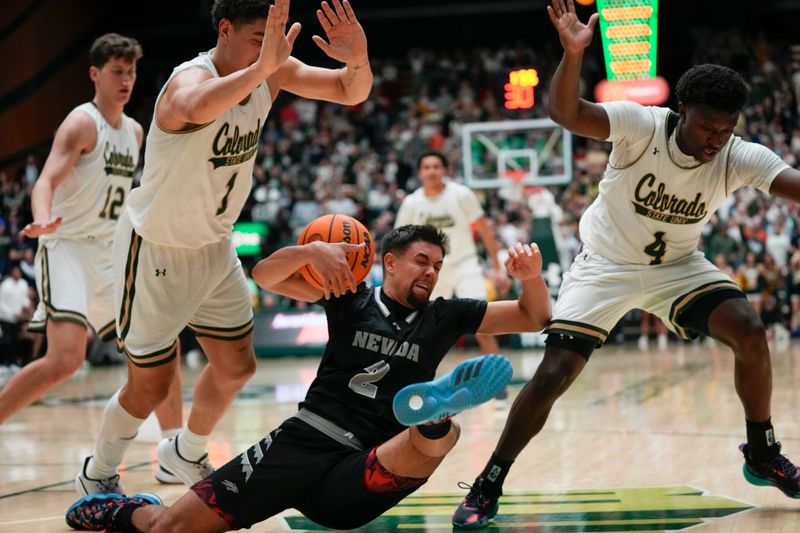 Feb 27, 2024; Fort Collins, Colorado, USA; Nevada Wolf Pack guard Jarod Lucas (2) goes down hard with Colorado State Rams forward Joel Scott (1) (left) and Colorado State Rams guard Isaiah Stevens (4) defending during the second half at Moby Arena. Mandatory Credit: Michael Madrid-USA TODAY Sports