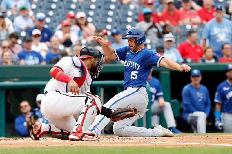 Sep 26, 2024; Washington, District of Columbia, USA; Kansas City Royals shortstop Paul DeJong (15) scores a run ahead of a tag by Washington Nationals catcher Keibert Ruiz (20) during the fourth inning at Nationals Park. Mandatory Credit: Geoff Burke-Imagn Images