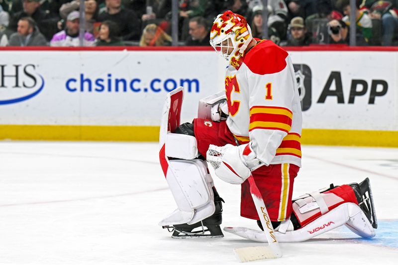 Jan 29, 2026; Saint Paul, Minnesota, USA;  Calgary Flames goalie Devin Cooley (1) takes a breather against the Minnesota Wild during the second period at Grand Casino Arena. Mandatory Credit: Nick Wosika-Imagn Images