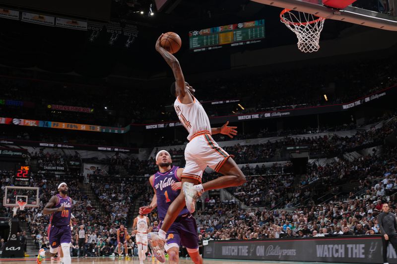 SAN ANTONIO, TX - MARCH 25: Blake Wesley #14 of the San Antonio Spurs drives to the basket during the game against the Phoenix Suns on March 25, 2024 at the AT&T Center in San Antonio, Texas. NOTE TO USER: User expressly acknowledges and agrees that, by downloading and or using this photograph, user is consenting to the terms and conditions of the Getty Images License Agreement. Mandatory Copyright Notice: Copyright 2024 NBAE (Photos by Jesse D. Garrabrant/NBAE via Getty Images)