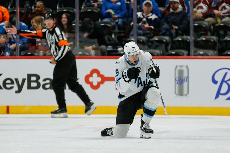 Sep 21, 2025; Denver, Colorado, USA; Utah Mammoth left wing Daniil But (19) celebrates after his goal in the second period against the Colorado Avalanche at Ball Arena. Mandatory Credit: Isaiah J. Downing-Imagn Images