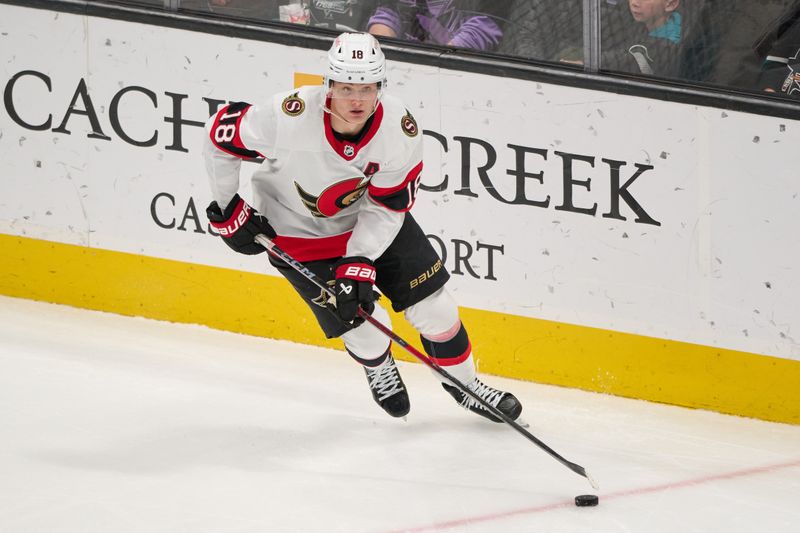 Mar 9, 2024; San Jose, California, USA; Ottawa Senators center Tim Stutzle (18) plays the puck against the San Jose Sharks during the third period at SAP Center at San Jose. Mandatory Credit: Robert Edwards-USA TODAY Sports