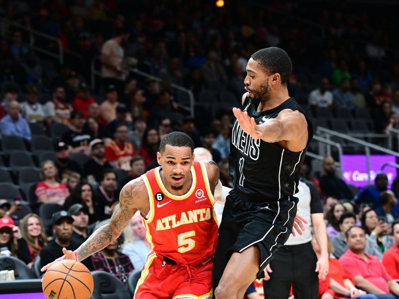 ATLANTA, GA - FEBRUARY 26: Dejounte Murray #5 of the Atlanta Hawks dribbles the ball during the game against the Brooklyn Nets on February 26, 2023 at State Farm Arena in Atlanta, Georgia.  NOTE TO USER: User expressly acknowledges and agrees that, by downloading and/or using this Photograph, user is consenting to the terms and conditions of the Getty Images License Agreement. Mandatory Copyright Notice: Copyright 2023 NBAE (Photo by Adam Hagy/NBAE via Getty Images)