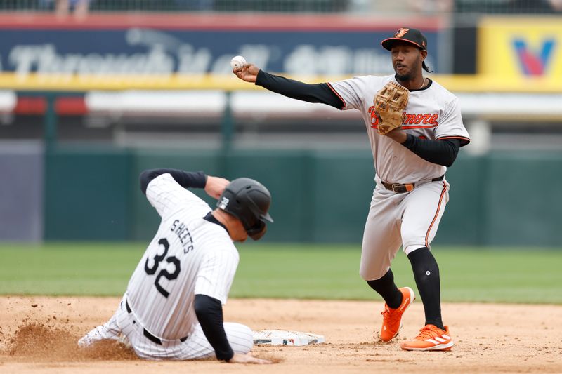 May 26, 2024; Chicago, Illinois, USA; Baltimore Orioles second baseman Jorge Mateo (3) throws out Chicago White Sox outfielder Gavin Sheets (32) at second base during the fourth inning at Guaranteed Rate Field. Mandatory Credit: Kamil Krzaczynski-USA TODAY Sports