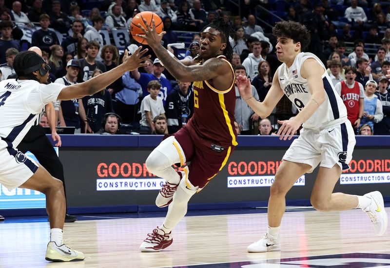 Feb 1, 2026; University Park, Pennsylvania, USA; Minnesota Golden Gophers guard Langston Reynolds (6) drives the ball towards the basket as Penn State Nittany Lions guard Kayden Mingo (4) and guard Melih Tunca (9) defend during the second half at Bryce Jordan Center. Mandatory Credit: Matthew O'Haren-Imagn Images