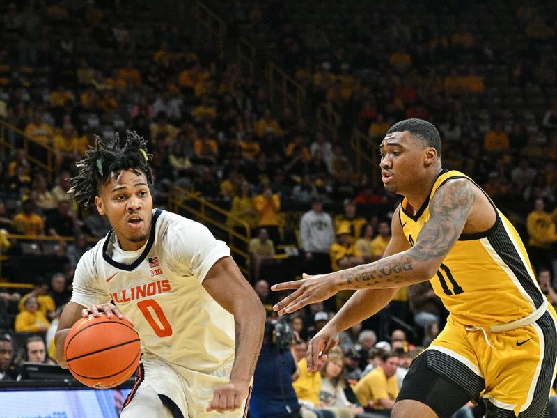 Mar 10, 2024; Iowa City, Iowa, USA; Illinois Fighting Illini guard Terrence Shannon Jr. (0) goes to the basket as Iowa Hawkeyes guard Tony Perkins (11) defends during the first half at Carver-Hawkeye Arena. Mandatory Credit: Jeffrey Becker-USA TODAY Sports