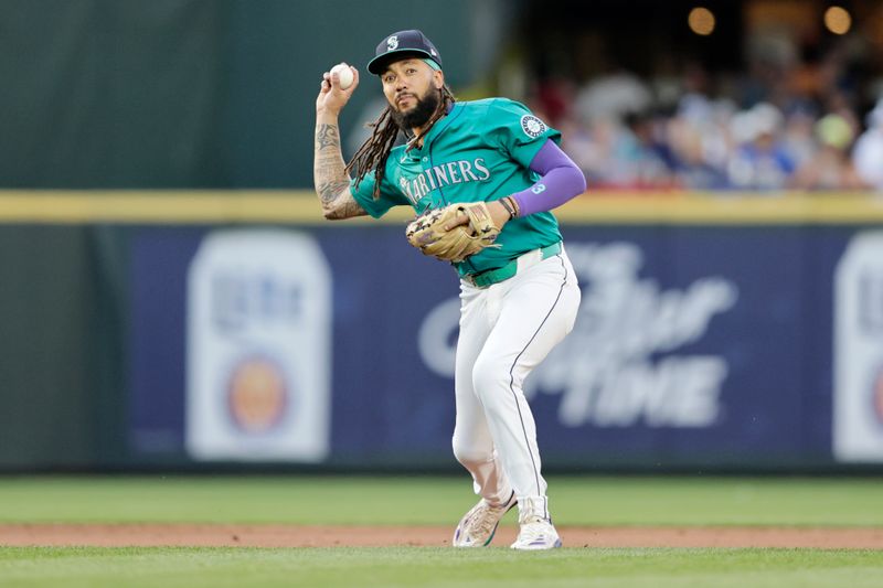 Jul 20, 2024; Seattle, Washington, USA; Seattle Mariners shortstop J.P. Crawford (3) throws to first base to retire Houston Astros second baseman Jose Altuve (not pictured) during the fifth inning  at T-Mobile Park. Mandatory Credit: John Froschauer-USA TODAY Sports