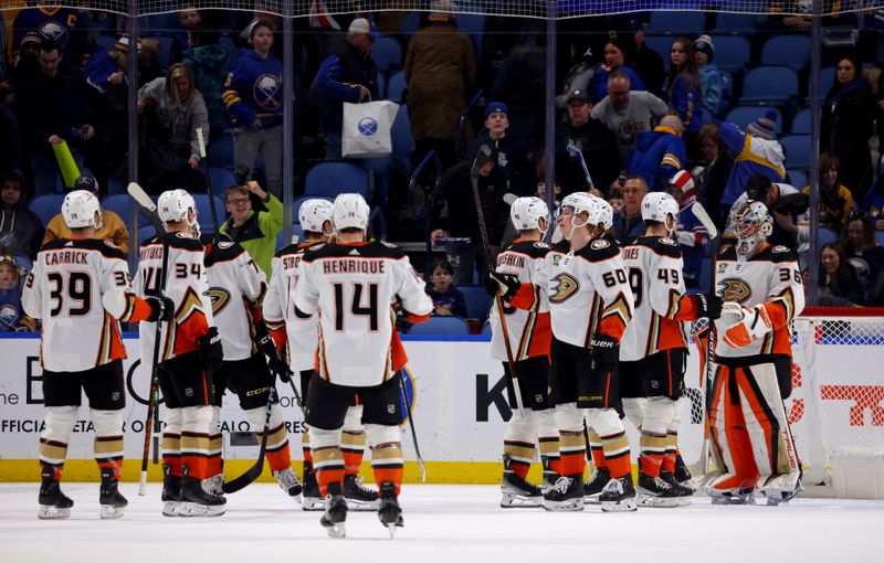 Feb 19, 2024; Buffalo, New York, USA;  The Anaheim Ducks celebrate a win over the Buffalo Sabres at KeyBank Center. Mandatory Credit: Timothy T. Ludwig-USA TODAY Sports