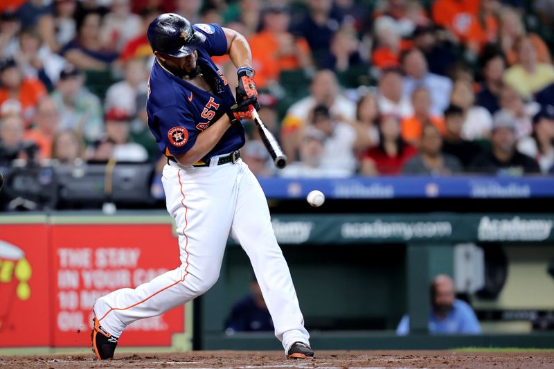 Jul 30, 2023; Houston, Texas, USA; Houston Astros first baseman Jose Abreu (79) hits an infield single against the Tampa Bay Rays during the second inning at Minute Maid Park. Mandatory Credit: Erik Williams-USA TODAY Sports