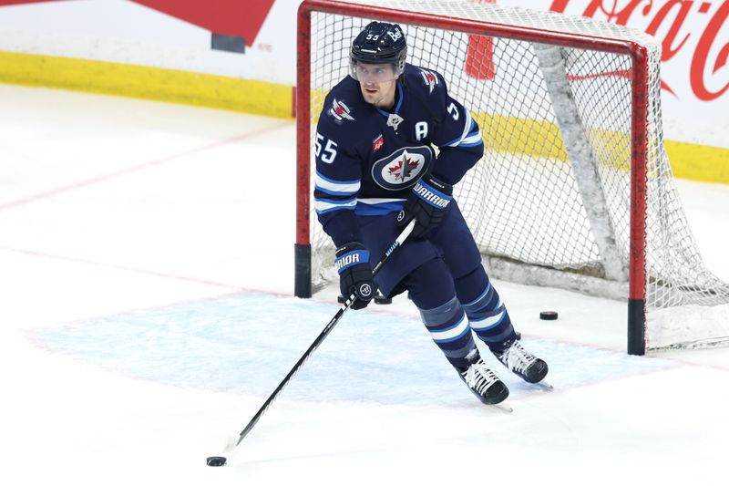 Apr 13, 2025; Winnipeg, Manitoba, CAN; Winnipeg Jets center Mark Scheifele (55) warms up before a game against the Edmonton Oilers at Canada Life Centre. Mandatory Credit: James Carey Lauder-Imagn Images