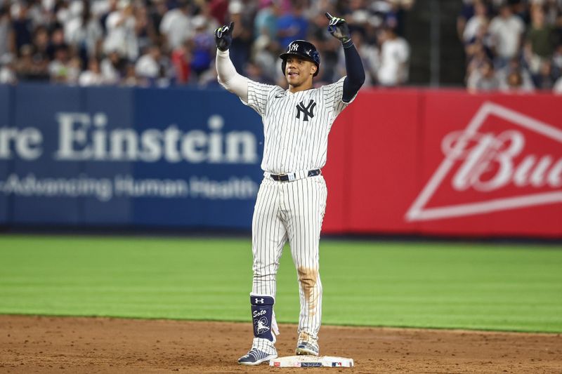 Jul 19, 2024; Bronx, New York, USA;  New York Yankees right fielder Juan Soto (22) gestures after hitting a double in the sixth inning against the Tampa Bay Rays at Yankee Stadium. Mandatory Credit: Wendell Cruz-USA TODAY Sports