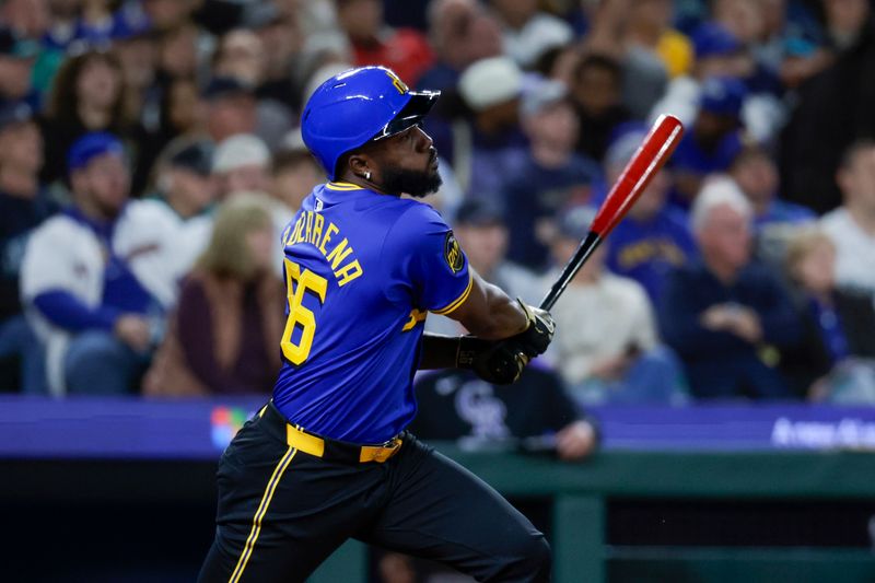 Sep 25, 2025; Seattle, Washington, USA; Seattle Mariners left fielder Randy Arozarena (56) hits a two-run single against the Colorado Rockies during the fourth inning at T-Mobile Park. Mandatory Credit: Joe Nicholson-Imagn Images